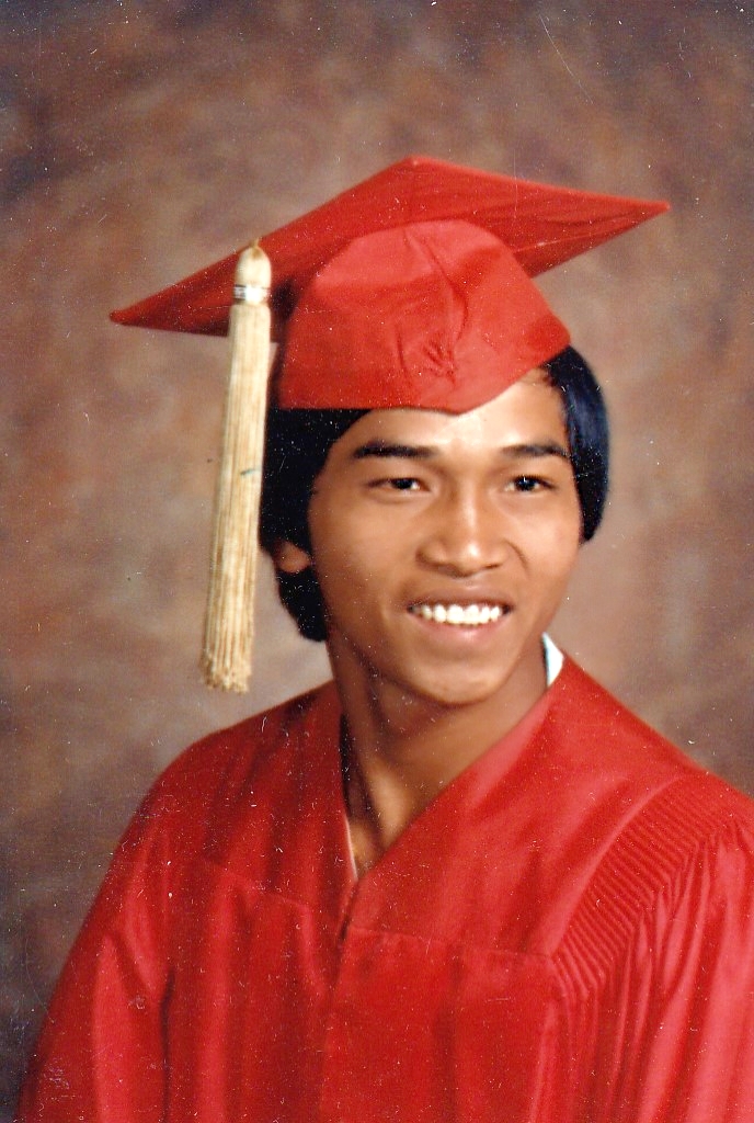 A picture of Paul S. Tuon in a graduation gown